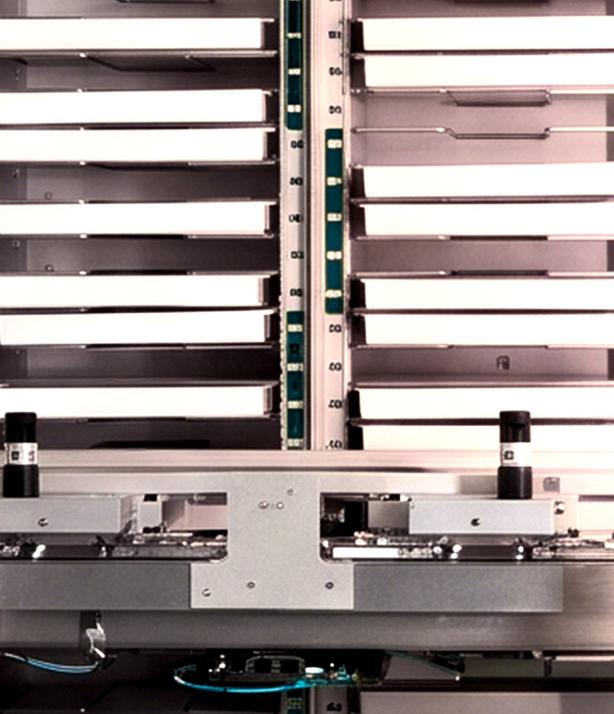 The refrigerated pizza racks and lift inside the kiosk