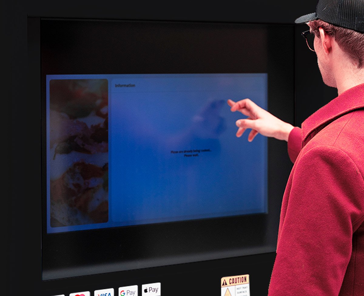 A customer ordering on the 32-inch touchscreen